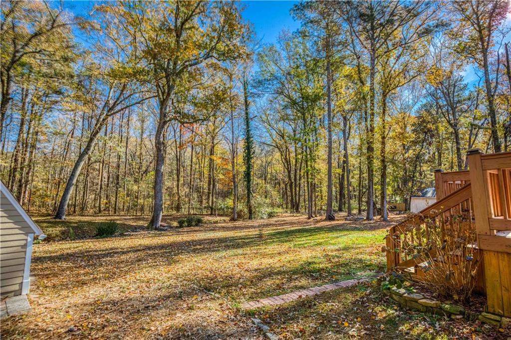23 Woodland Road Auburn, GA 30011 - Photo 32 of 34 a view of outdoor space with trees