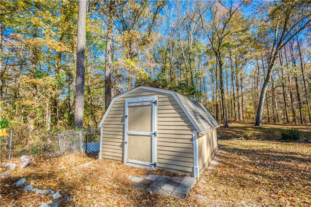 23 Woodland Road Auburn, GA 30011 - Photo 33 of 34 a view of a house with a yard