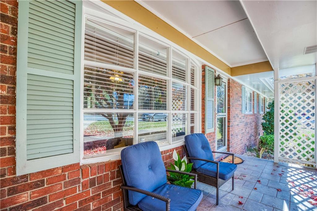 23 Woodland Road Auburn, GA 30011 - Photo 4 of 34 a balcony with furniture and wooden floor