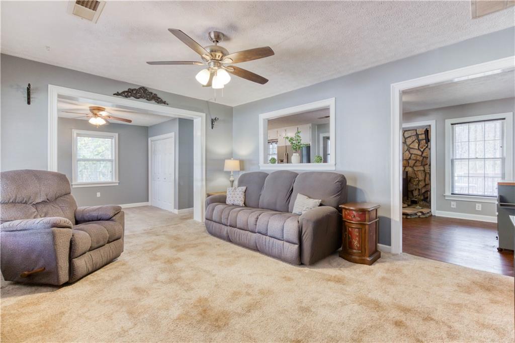 23 Woodland Road Auburn, GA 30011 - Photo 10 of 34 a living room with furniture and a large window