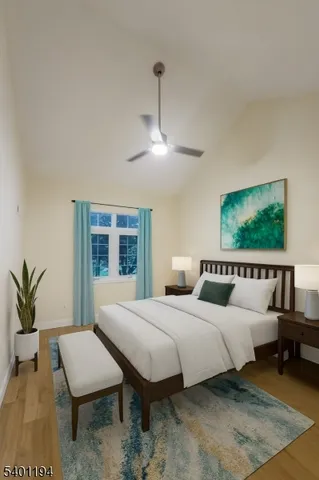 a bedroom with a bed a couch and potted plant with the dresser