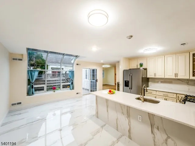 a view of a house with a flower garden