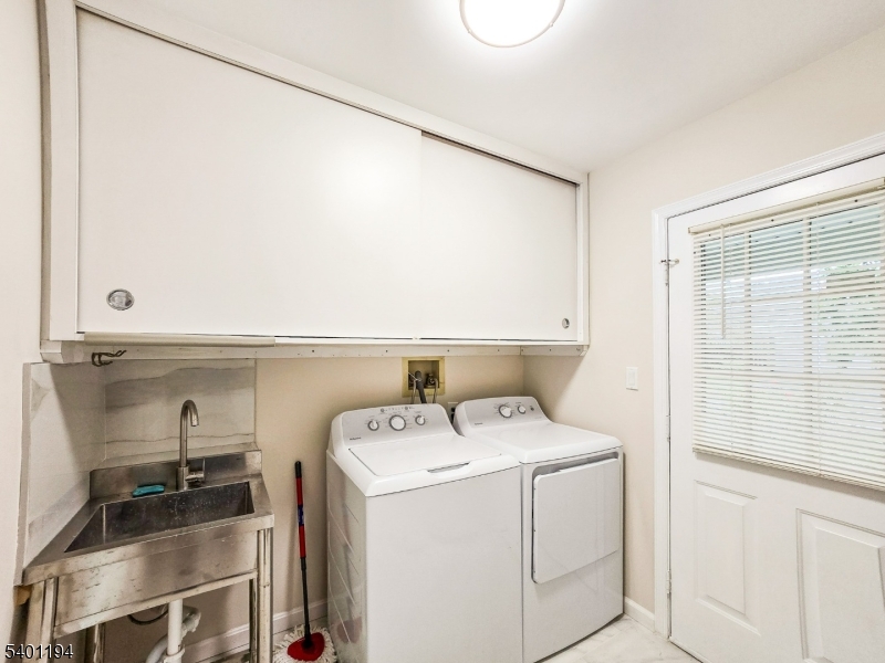 7B Rutland Lane Monroe Township, NJ 08831 - Photo 26 of 36 a utility room with dryer and washer