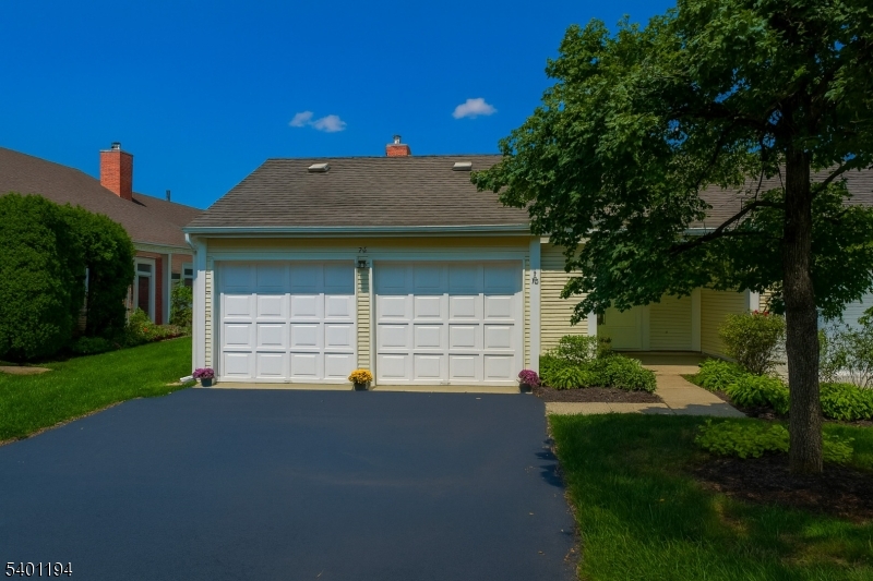7B Rutland Lane Monroe Township, NJ 08831 - Photo 3 of 36 a front view of a house with a yard and garage