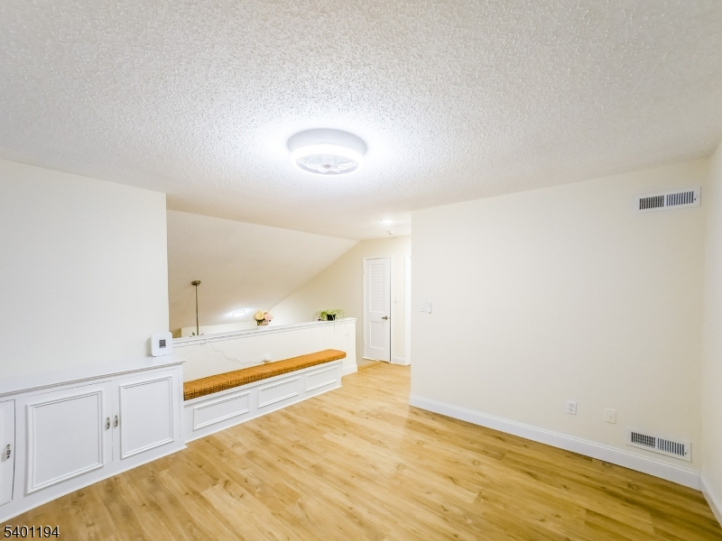 7B Rutland Lane Monroe Township, NJ 08831 - Photo 32 of 36 a view of a room with an empty space