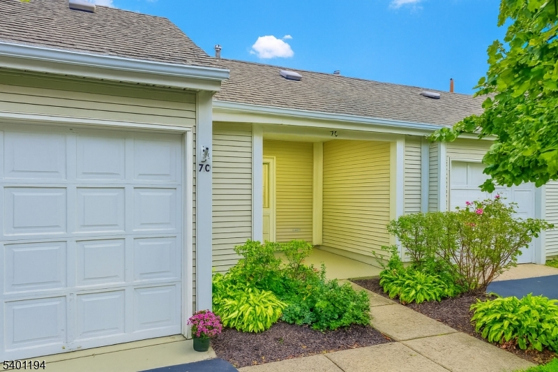 7B Rutland Lane Monroe Township, NJ 08831 - Photo 5 of 36 a front view of a house with a garden