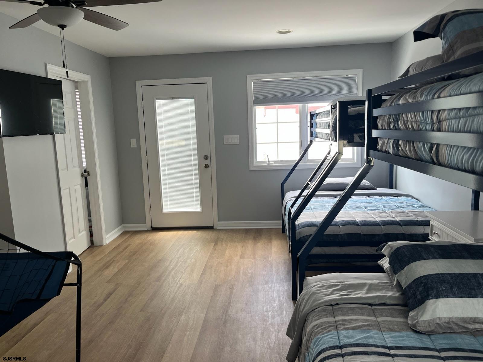 205 Palermo Avenue Egg Harbor Township, NJ 08232 - Photo 5 of 7 a view of a livingroom with furniture a fireplace wooden floor and windows