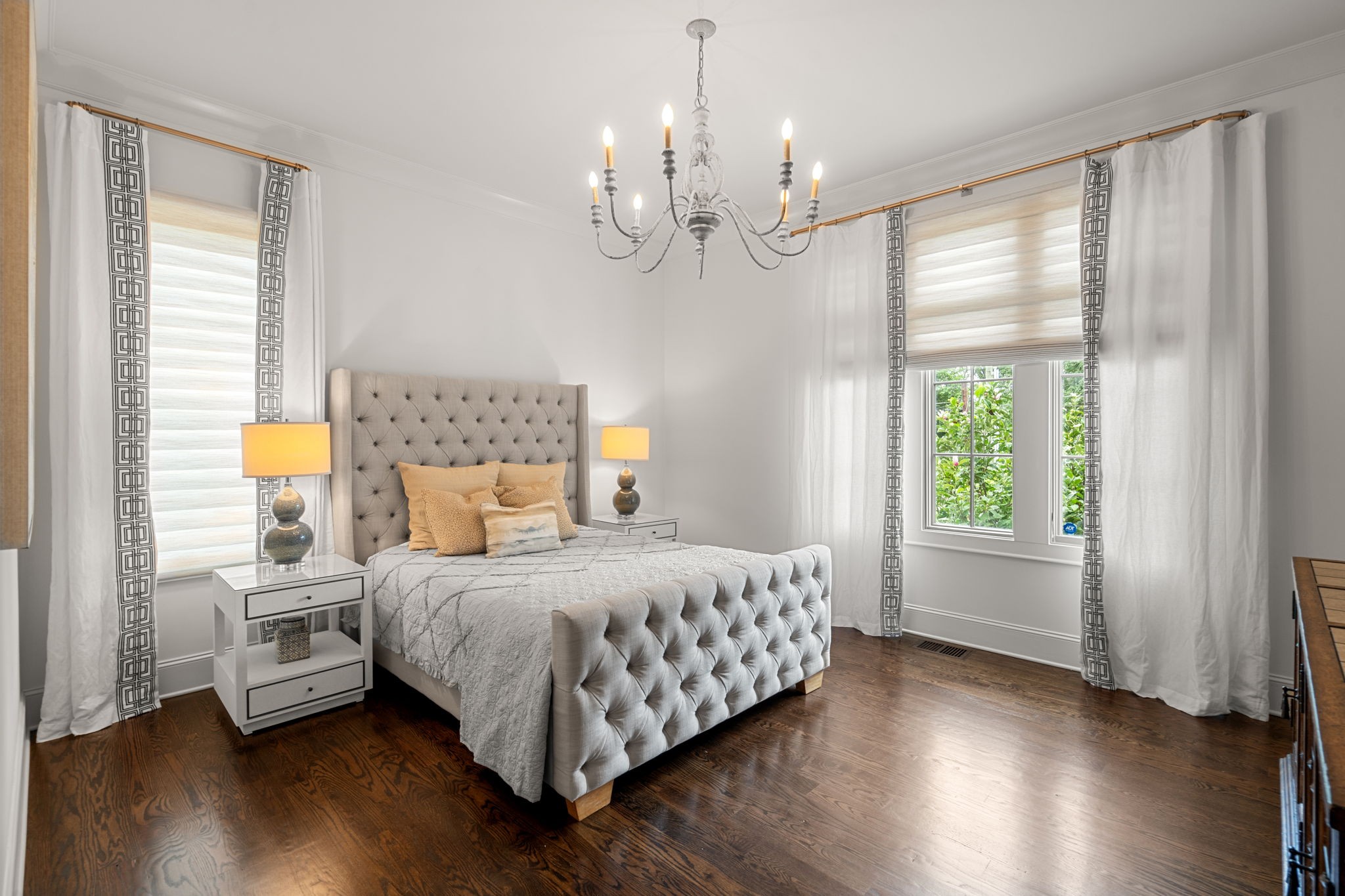 4031 Sneed Road Nashville, TN 37215 - Photo 32 of 61 a bedroom with a bed chandelier and a window