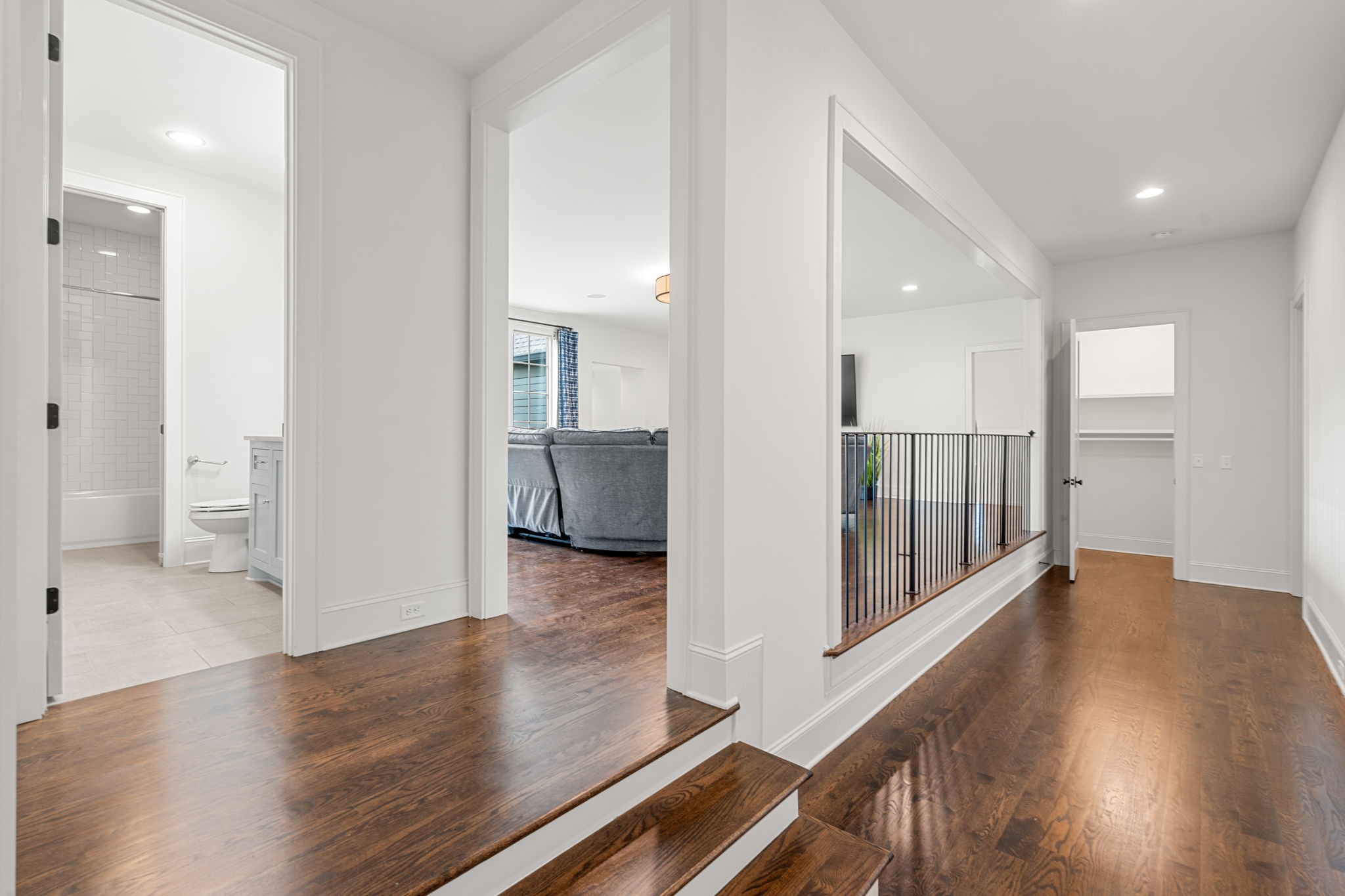 4031 Sneed Road Nashville, TN 37215 - Photo 38 of 61 a view of a hallway with wooden floor and a living room