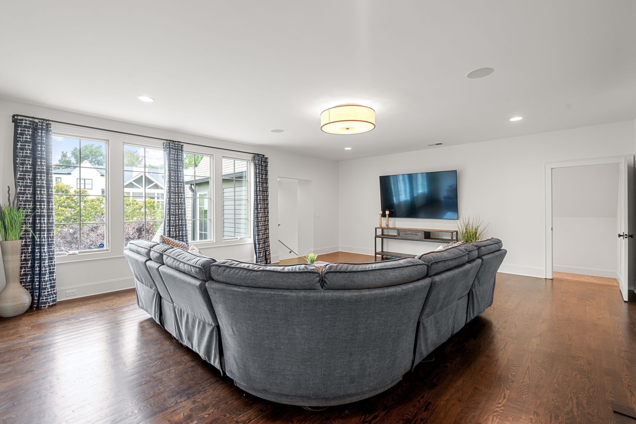 4031 Sneed Road Nashville, TN 37215 - Photo 39 of 61 a living room with furniture and a flat screen tv