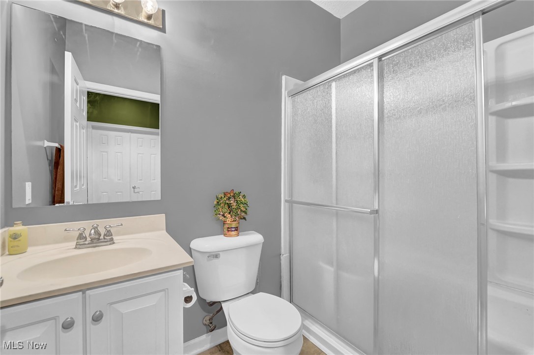 2690 Mayfair Road Akron, OH 44312 - Photo 24 of 31 Full bath featuring vanity and a stall shower