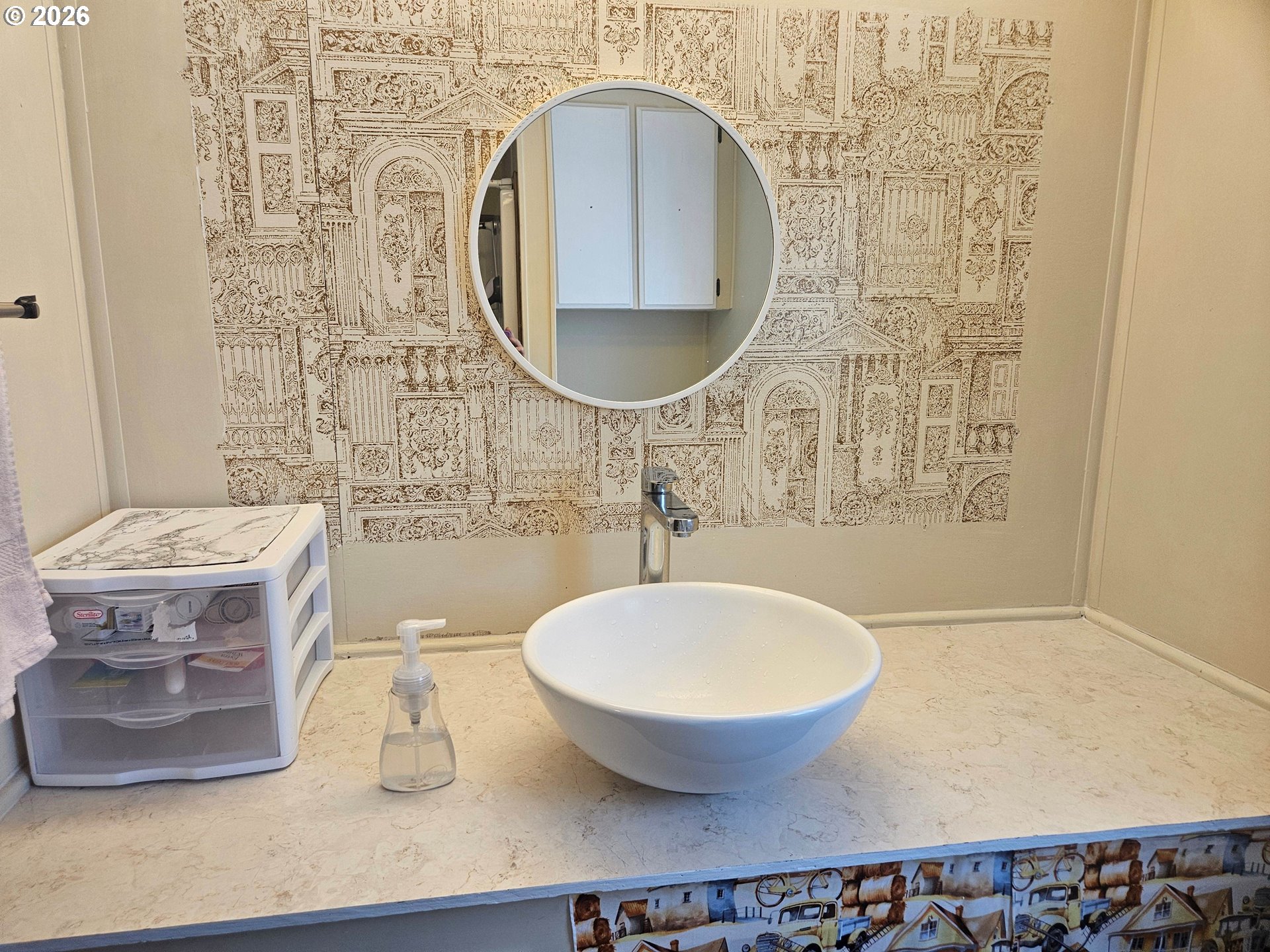 1600 Rhododendron Drive, Unit 214 Florence, OR 97439 - Photo 12 of 38 a bathroom with a sink and a mirror