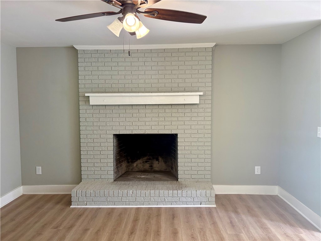 351 Randys Road Westminster, SC 29693 - Photo 11 of 30 A striking brick fireplace provides a focal point within this inviting living space.