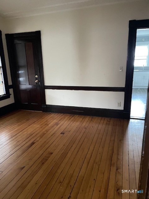 281 Chestnut Street New Britain, CT 06051 - Photo 19 of 33 a view of an empty room with wooden floor