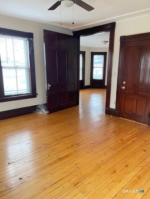 281 Chestnut Street New Britain, CT 06051 - Photo 25 of 33 a view of livingroom with hardwood floor and window