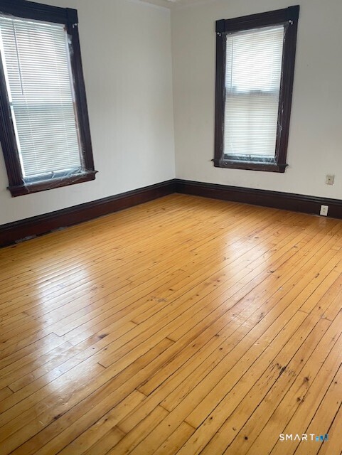281 Chestnut Street New Britain, CT 06051 - Photo 30 of 33 a view of a room with wooden floor and chair