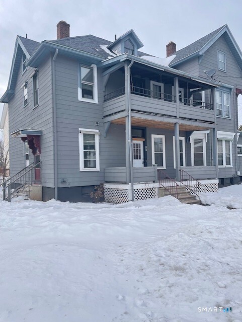 281 Chestnut Street New Britain, CT 06051 - Photo 4 of 33 a front view of a house with a yard