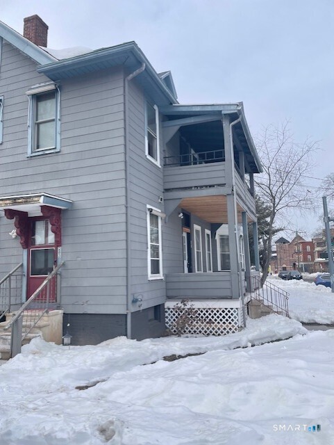 281 Chestnut Street New Britain, CT 06051 - Photo 6 of 33 a front view of a house with a yard