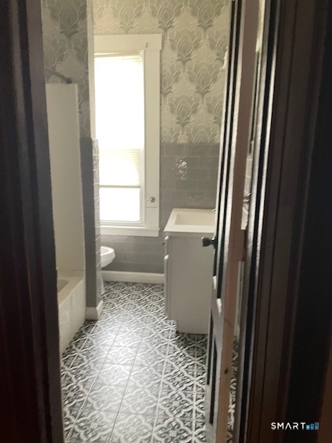 281 Chestnut Street New Britain, CT 06051 - Photo 7 of 18 a bathroom with a toilet and a shower
