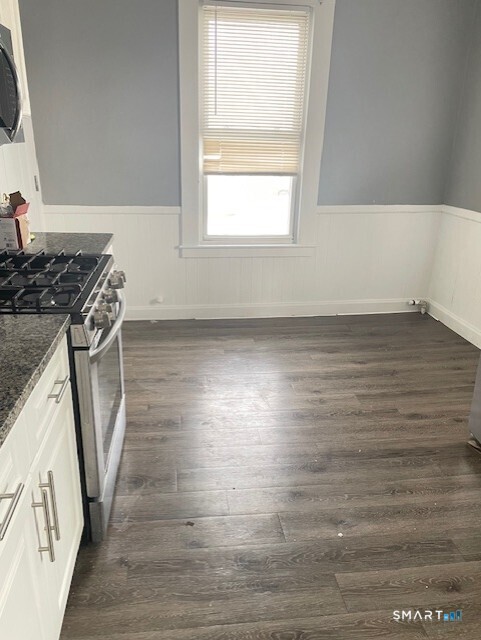281 Chestnut Street New Britain, CT 06051 - Photo 7 of 33 a view of a kitchen with wooden floor and a sink