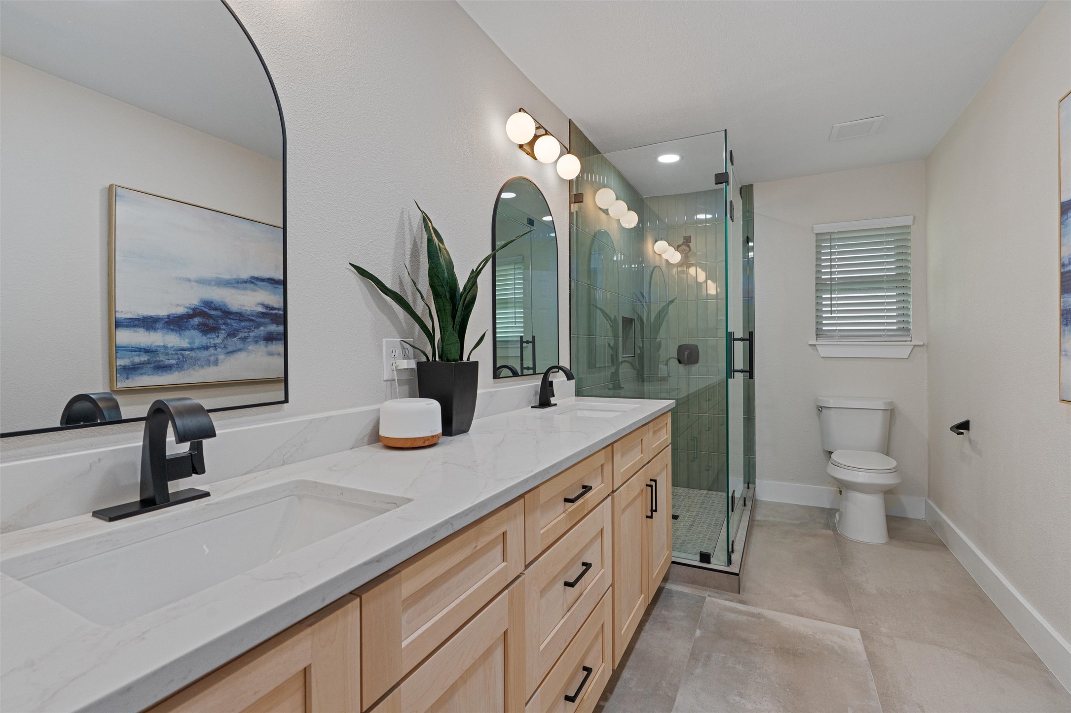 224 Clear Spring Road Georgetown, TX 78628 - Photo 29 of 40 a bathroom with a sink a toilet and a mirror