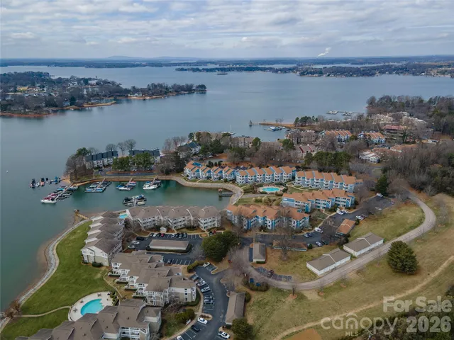 a view of a lake with city from a balcony