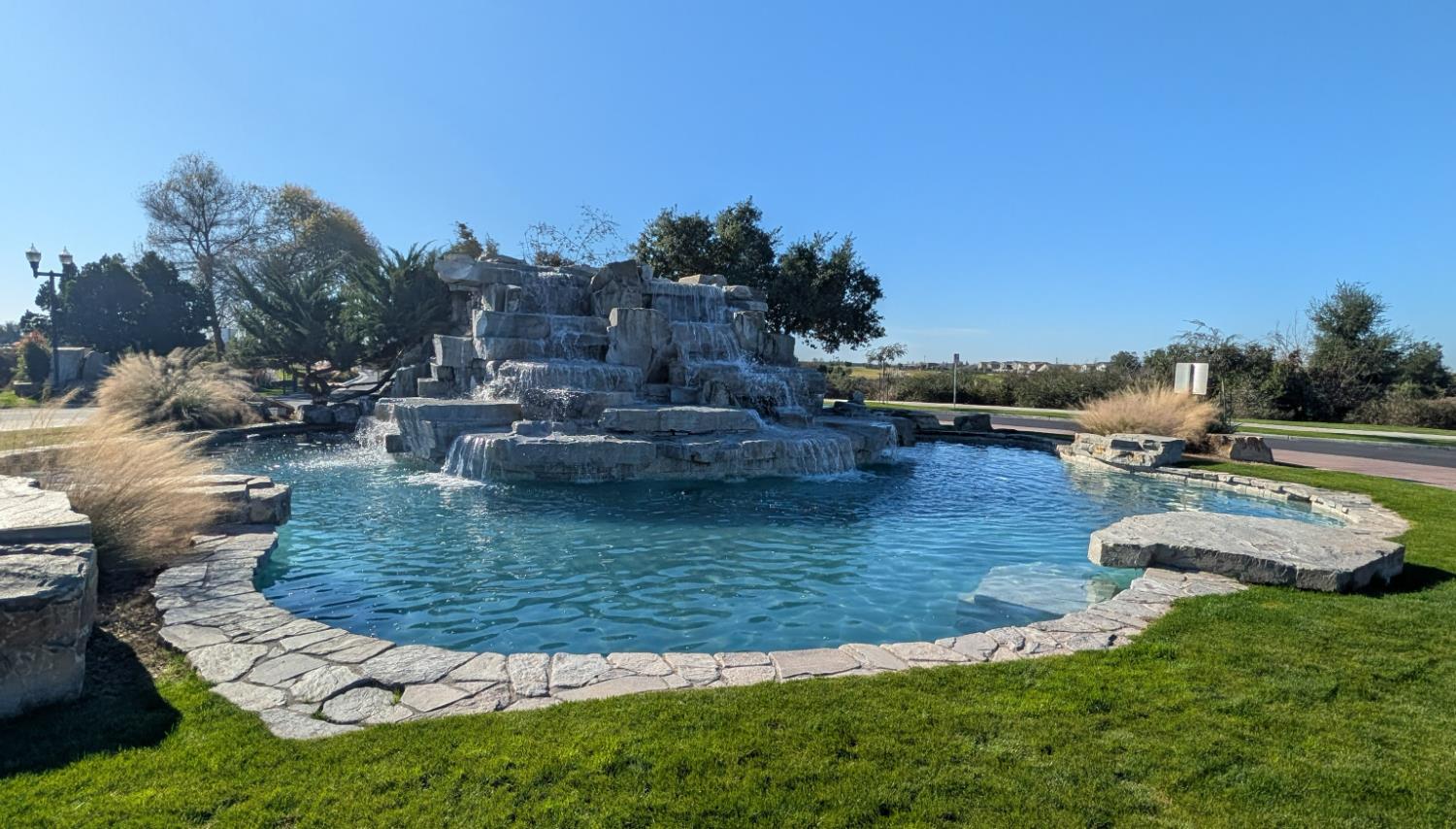 174 Emperor Way Dinuba, CA 93618 - Photo 23 of 23 a view of a water pond with outdoor seating