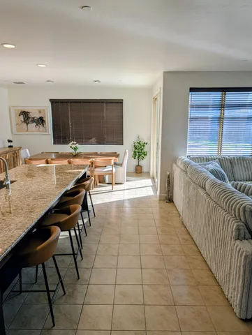 a living room with furniture and a table