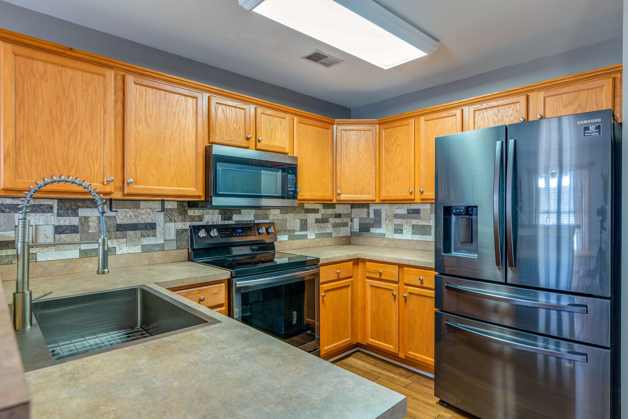 1517 Rachaels Ridge Hermitage, TN 37076 - Photo 9 of 32 a kitchen with stainless steel appliances granite countertop a refrigerator stove and sink