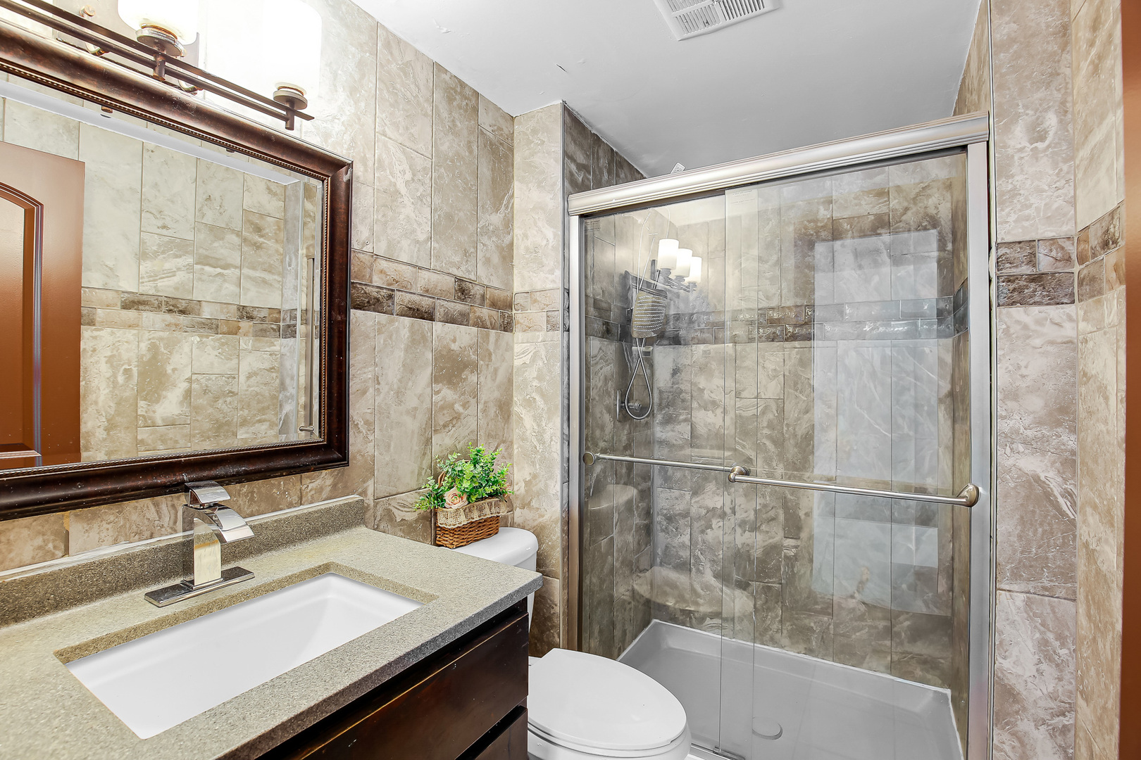 8424 Currant Avenue Tinley Park, IL 60487 - Photo 11 of 23 a bathroom with a sink toilet and shower