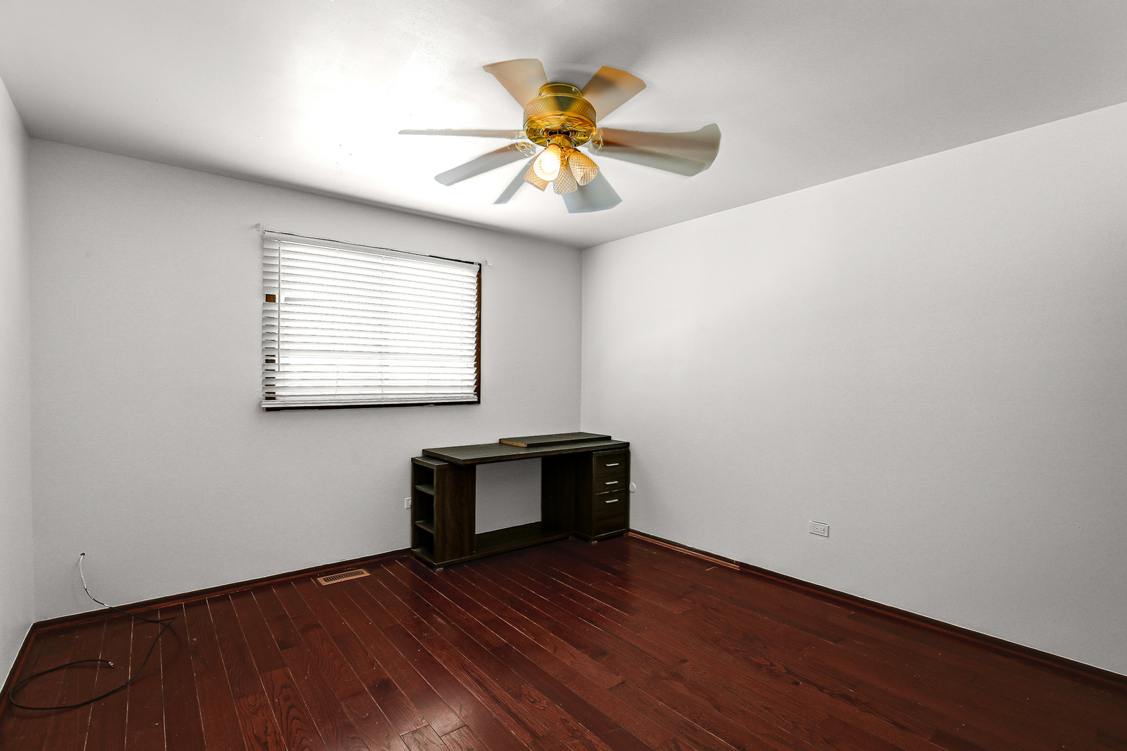 8424 Currant Avenue Tinley Park, IL 60487 - Photo 13 of 23 a view of an empty room with window and wooden floor