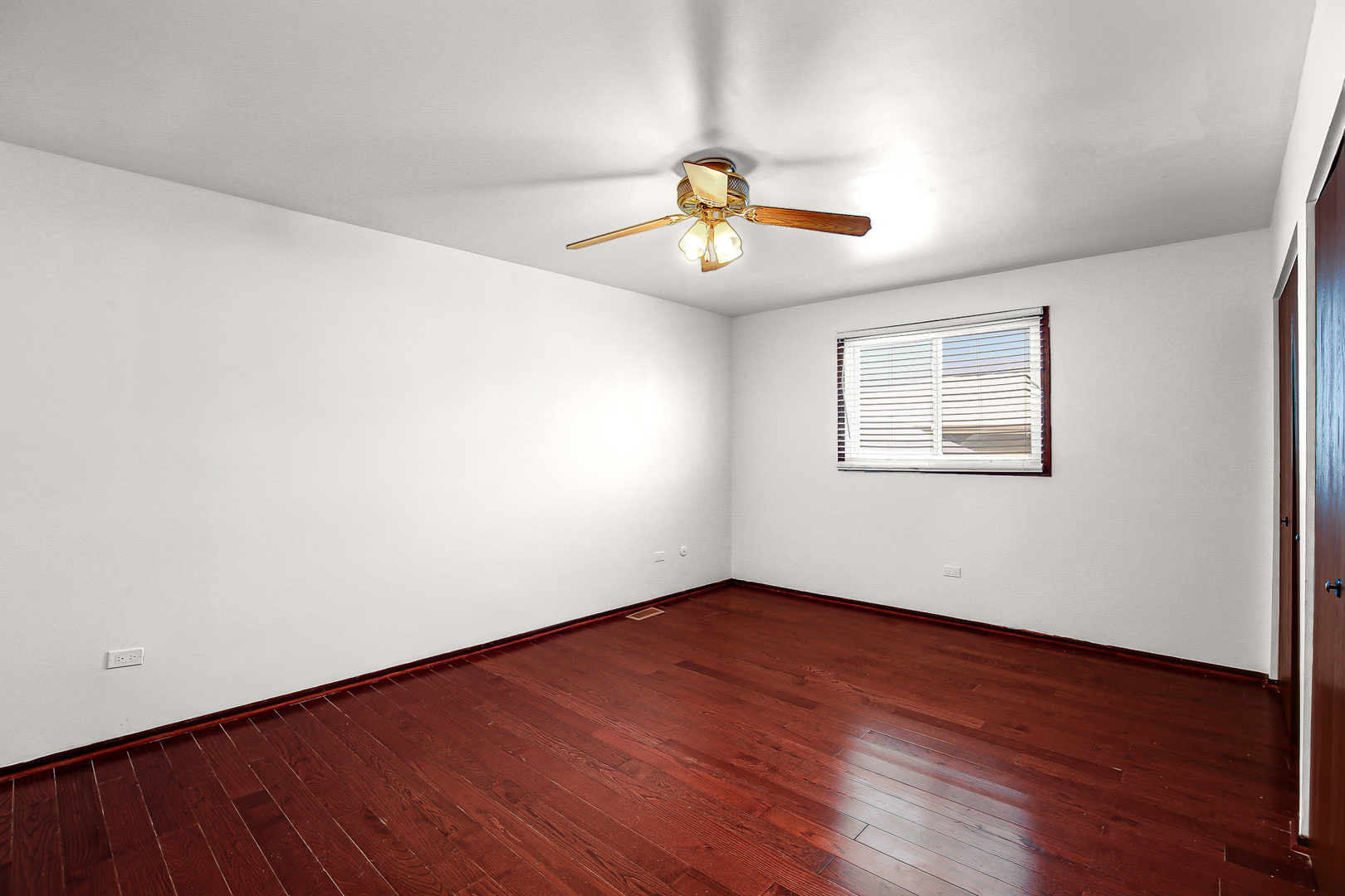 8424 Currant Avenue Tinley Park, IL 60487 - Photo 17 of 23 a view of a room with wooden floor and window