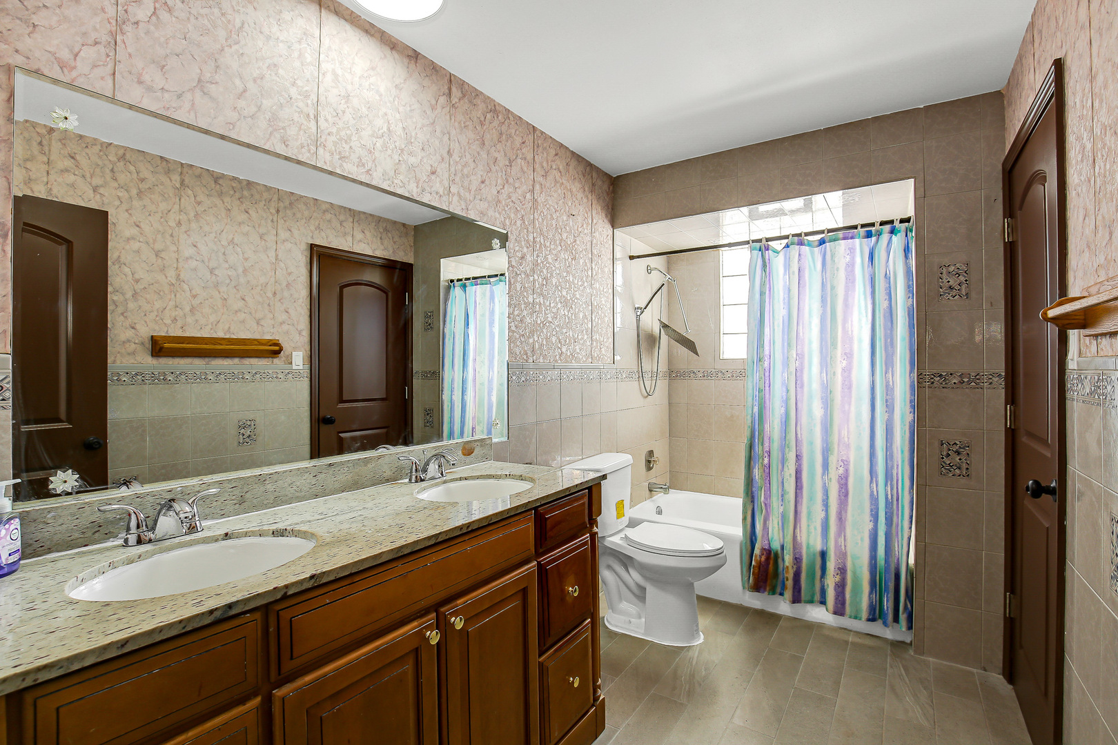 8424 Currant Avenue Tinley Park, IL 60487 - Photo 18 of 23 a bathroom with a double vanity sink toilet and a mirror