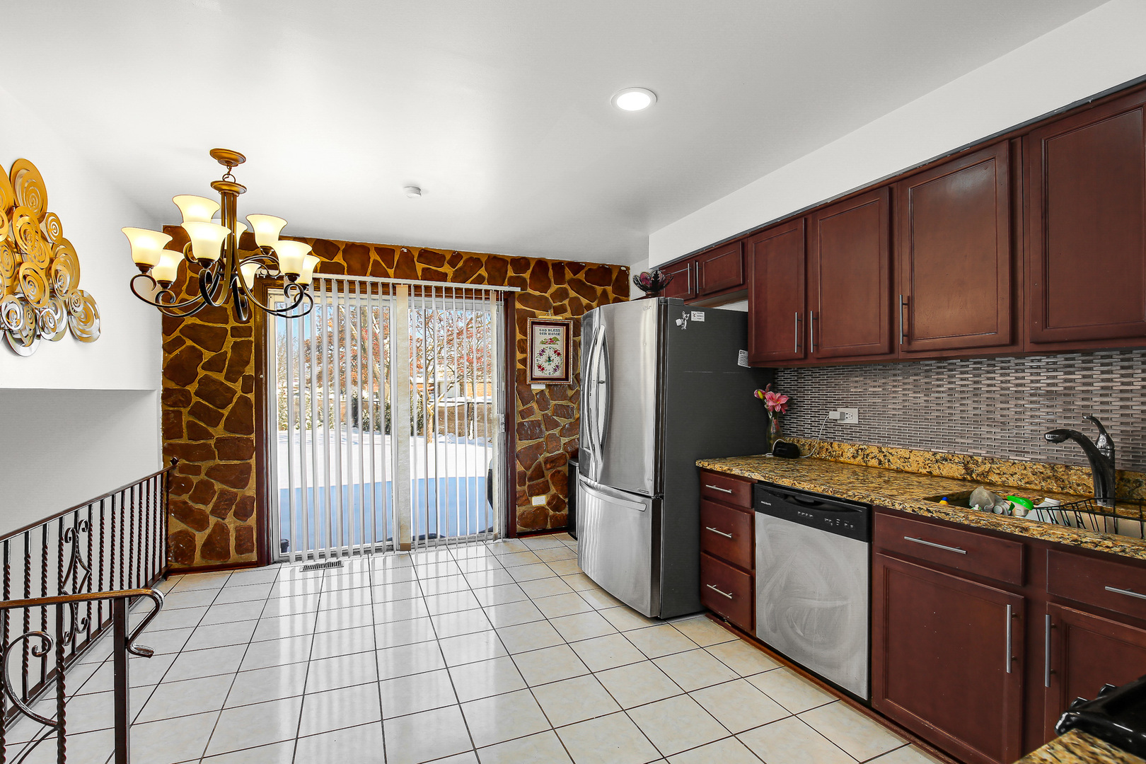 8424 Currant Avenue Tinley Park, IL 60487 - Photo 8 of 23 a kitchen with stainless steel appliances granite countertop a refrigerator and a sink