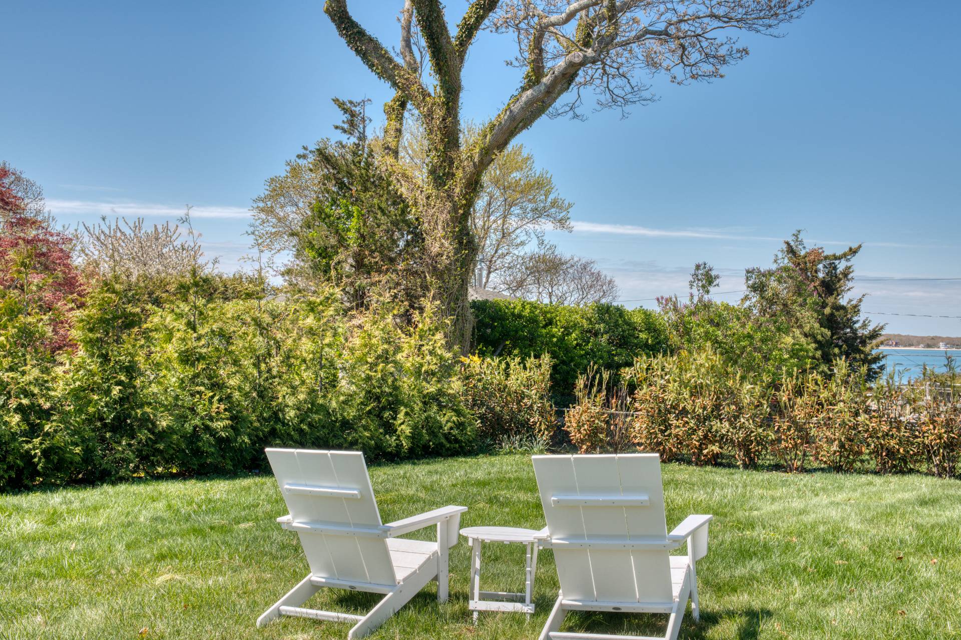 35 Ridge Drive Sag Harbor, NY 11963 - Photo 2 of 16 a view of a chair and table on the garden
