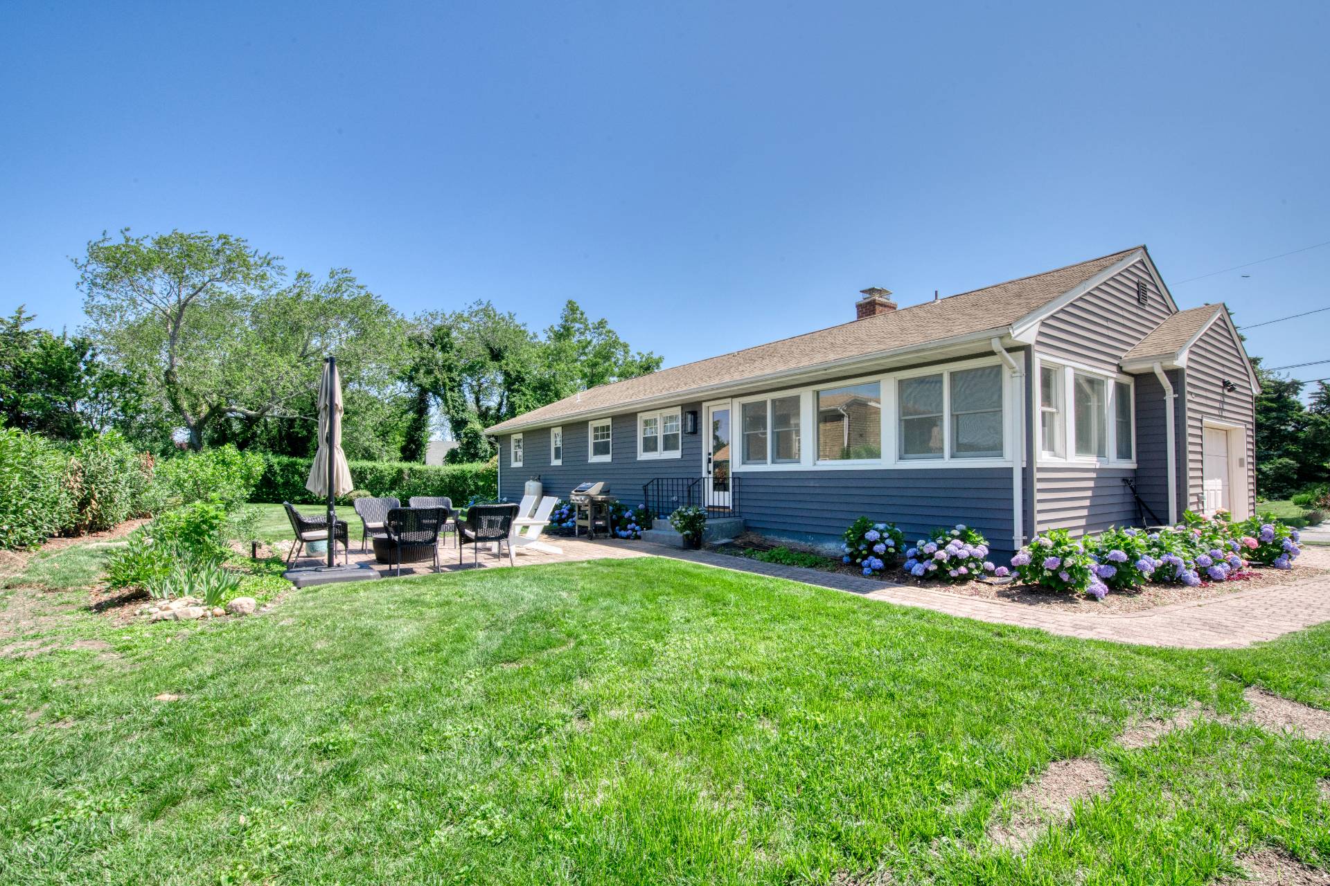 35 Ridge Drive Sag Harbor, NY 11963 - Photo 4 of 16 a view of a house with a yard porch and sitting area