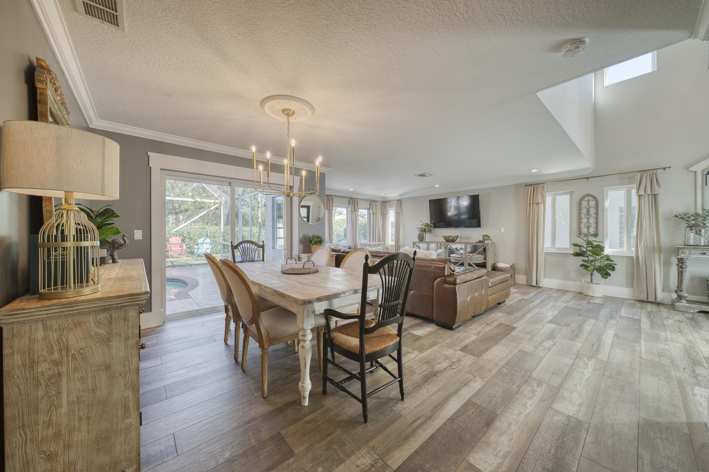 20323 Monteverdi Circle Boca Raton, FL 33498 - Photo 11 of 58 a view of a dining room with furniture window and wooden floor