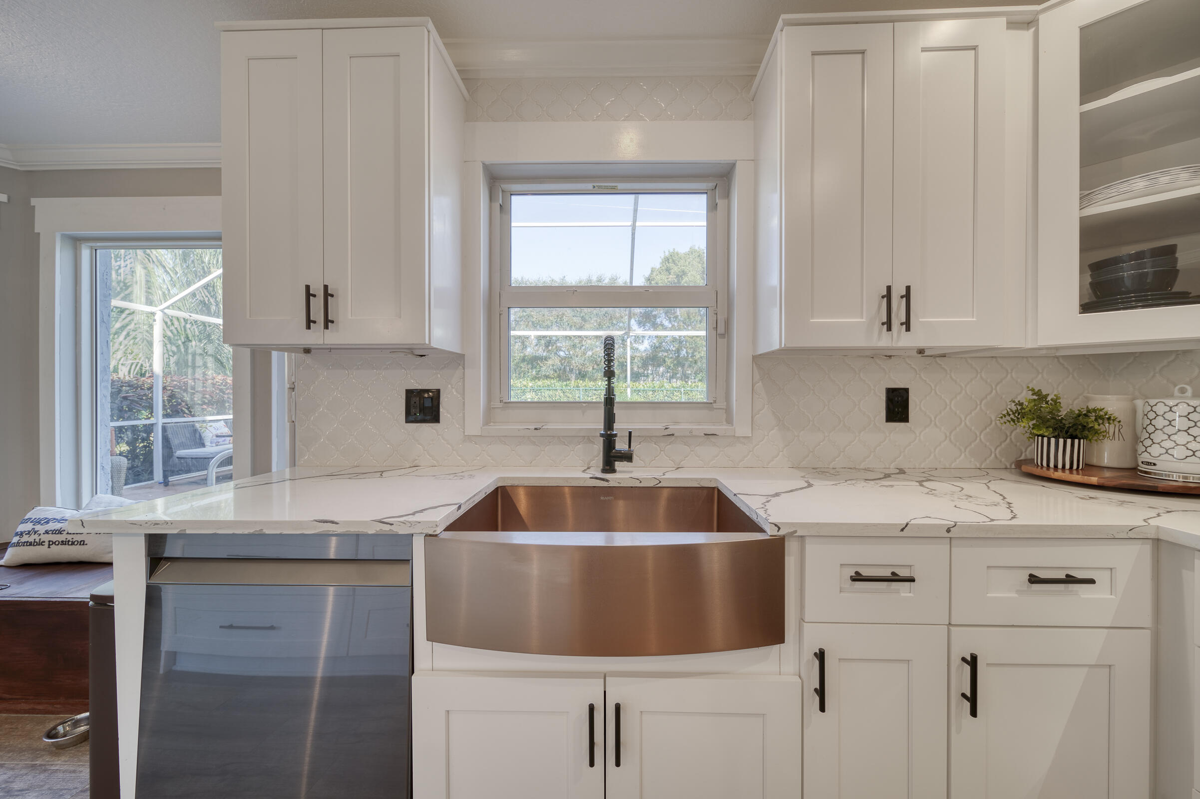 20323 Monteverdi Circle Boca Raton, FL 33498 - Photo 15 of 58 a kitchen with sink a window and cabinets