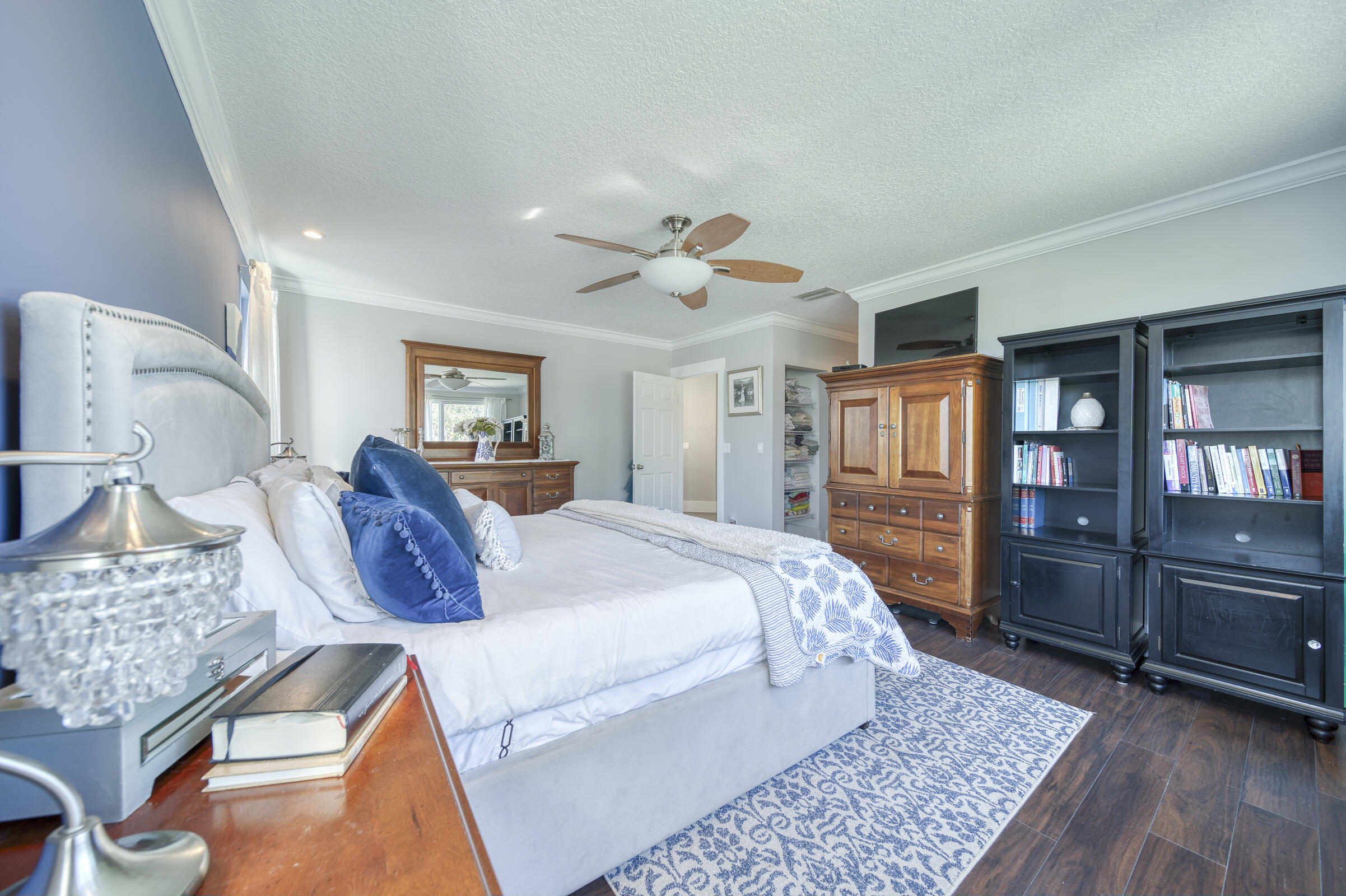 20323 Monteverdi Circle Boca Raton, FL 33498 - Photo 26 of 58 a bed room with a bed and dresser