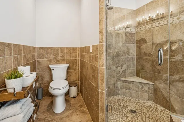 a bedroom with a bed and a table