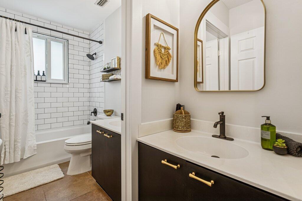 20323 Monteverdi Circle Boca Raton, FL 33498 - Photo 34 of 58 a bathroom with a sink a toilet and mirror