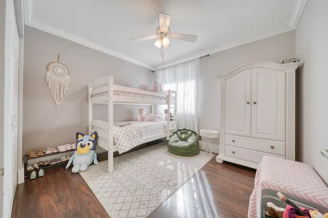 a view of a house with backyard sitting area and garden