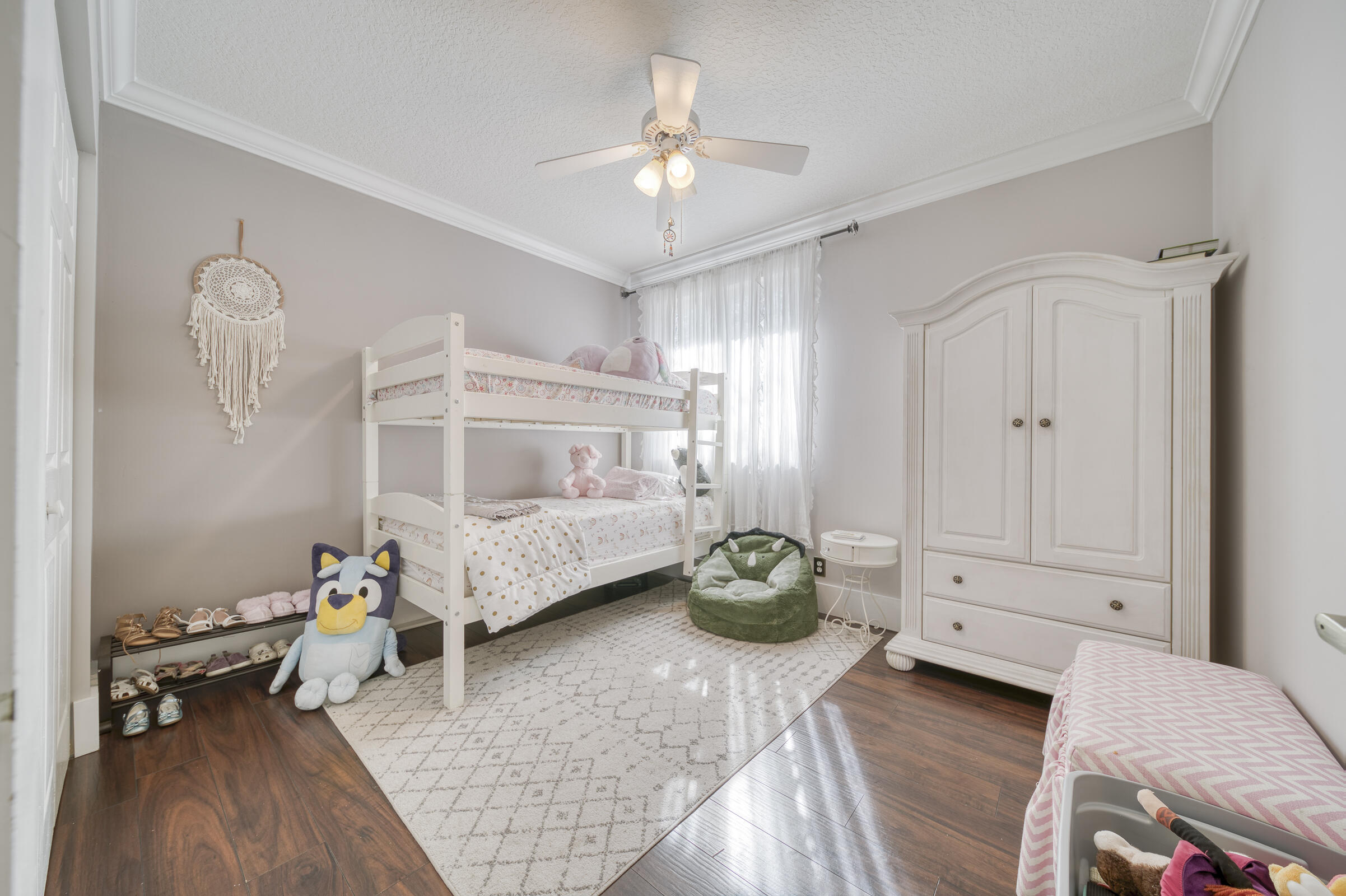 20323 Monteverdi Circle Boca Raton, FL 33498 - Photo 36 of 58 a bedroom with a bed and a chandelier