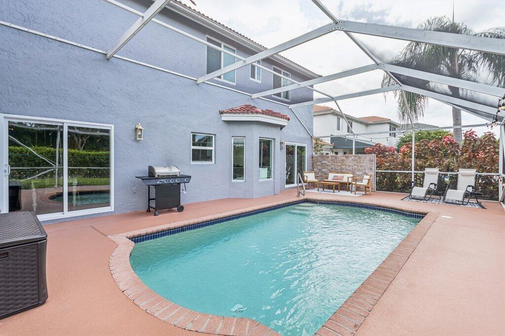 20323 Monteverdi Circle Boca Raton, FL 33498 - Photo 39 of 58 a swimming pool with outdoor seating and yard