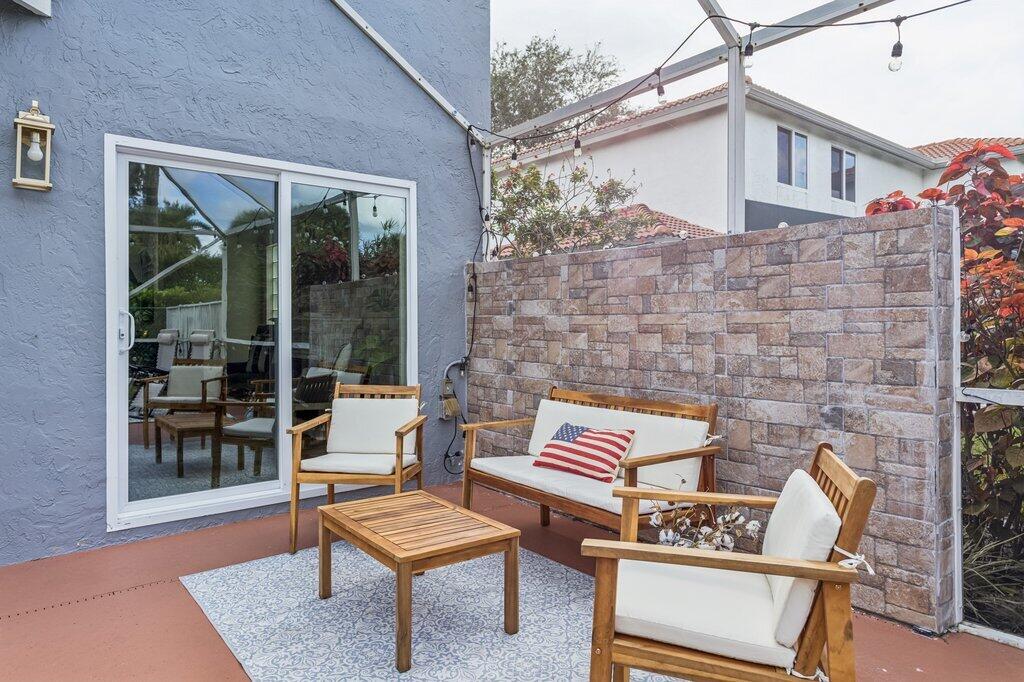 20323 Monteverdi Circle Boca Raton, FL 33498 - Photo 41 of 58 a outdoor living space with furniture and a rug
