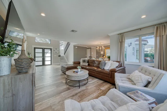 a view of a dining room with furniture window and wooden floor