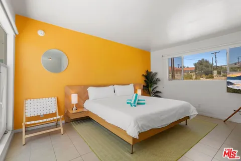 a dining room with a table and chairs