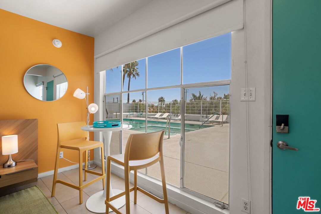 12689 Eliseo Road Desert Hot Springs, CA 92240 - Photo 12 of 28 a dining room with a table and chairs