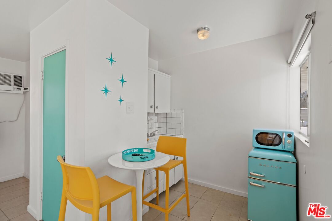 12689 Eliseo Road Desert Hot Springs, CA 92240 - Photo 19 of 28 a room with a table and chairs