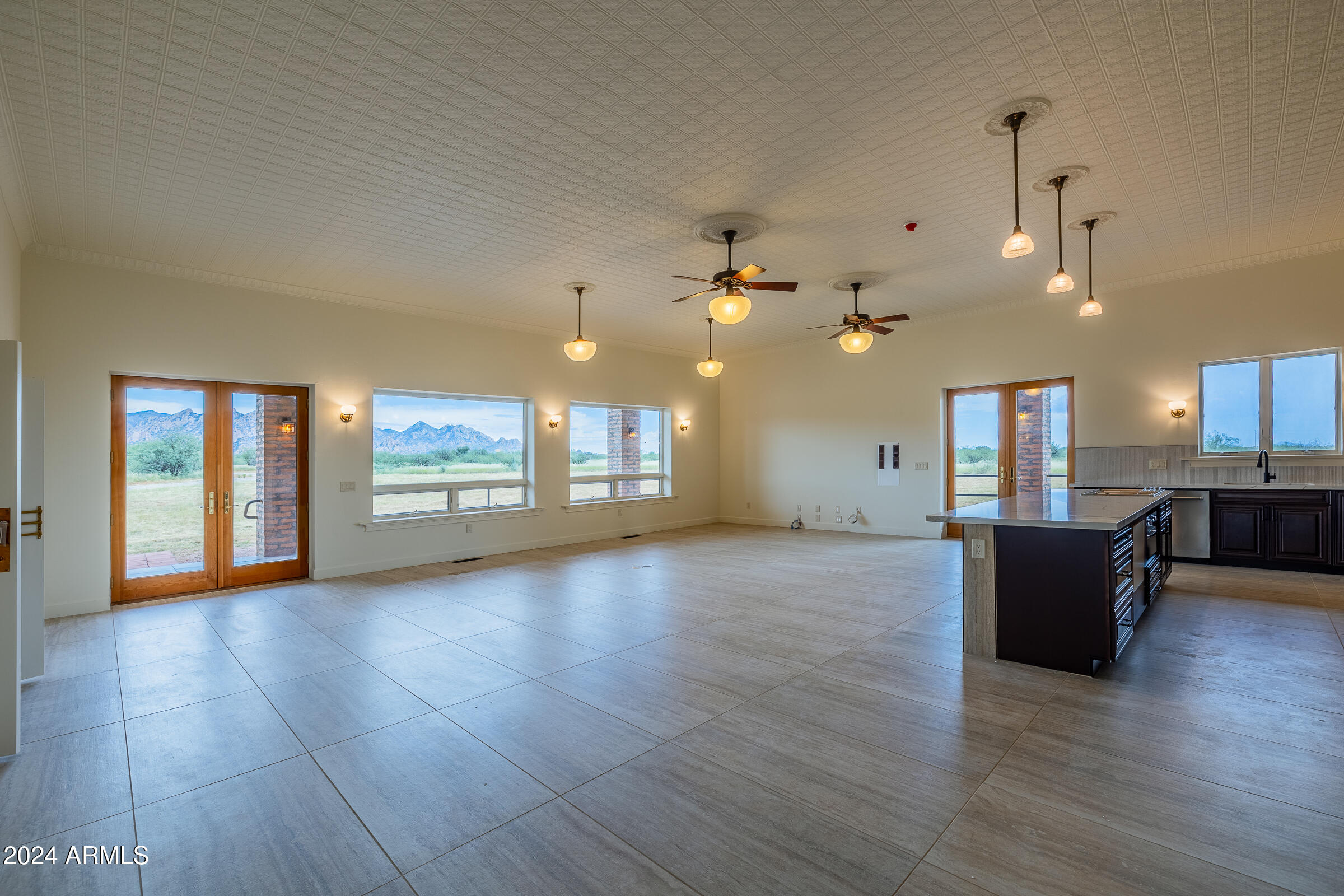1044 North Dragoon Ranch Road St. David, AZ 85630 - Photo 2 of 57 a view of a living room a kitchen and a wooden floor